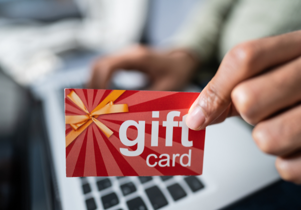 Image Description: Hand holding a Gift Card