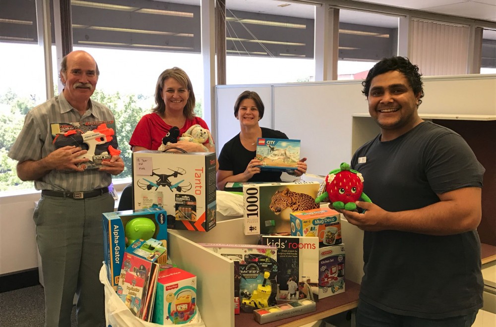 Department of Education staff in Bathurst generously supported the 2016 Veritas Xmas appeal. DEC staff (L-R) Peter Cole, Karyn Whalan and Roberta Lawson present their gifts to Veritas House Case Worker, Katon Crawford.